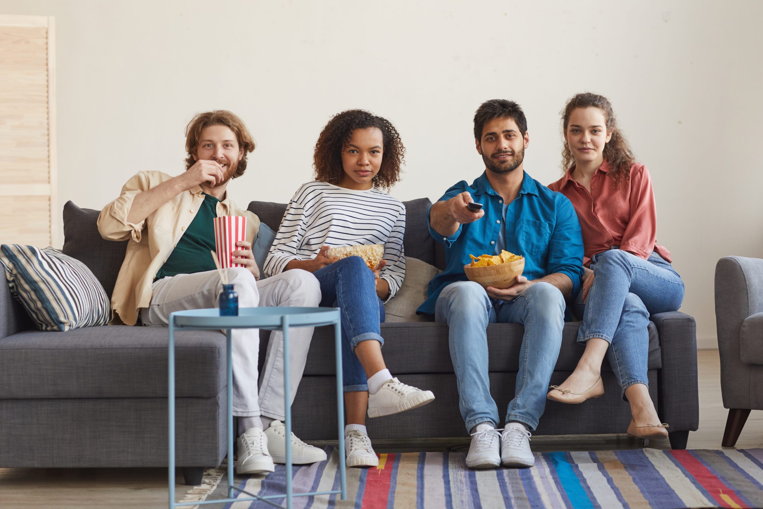 Multi Ethnic Group of Friends Watching TV